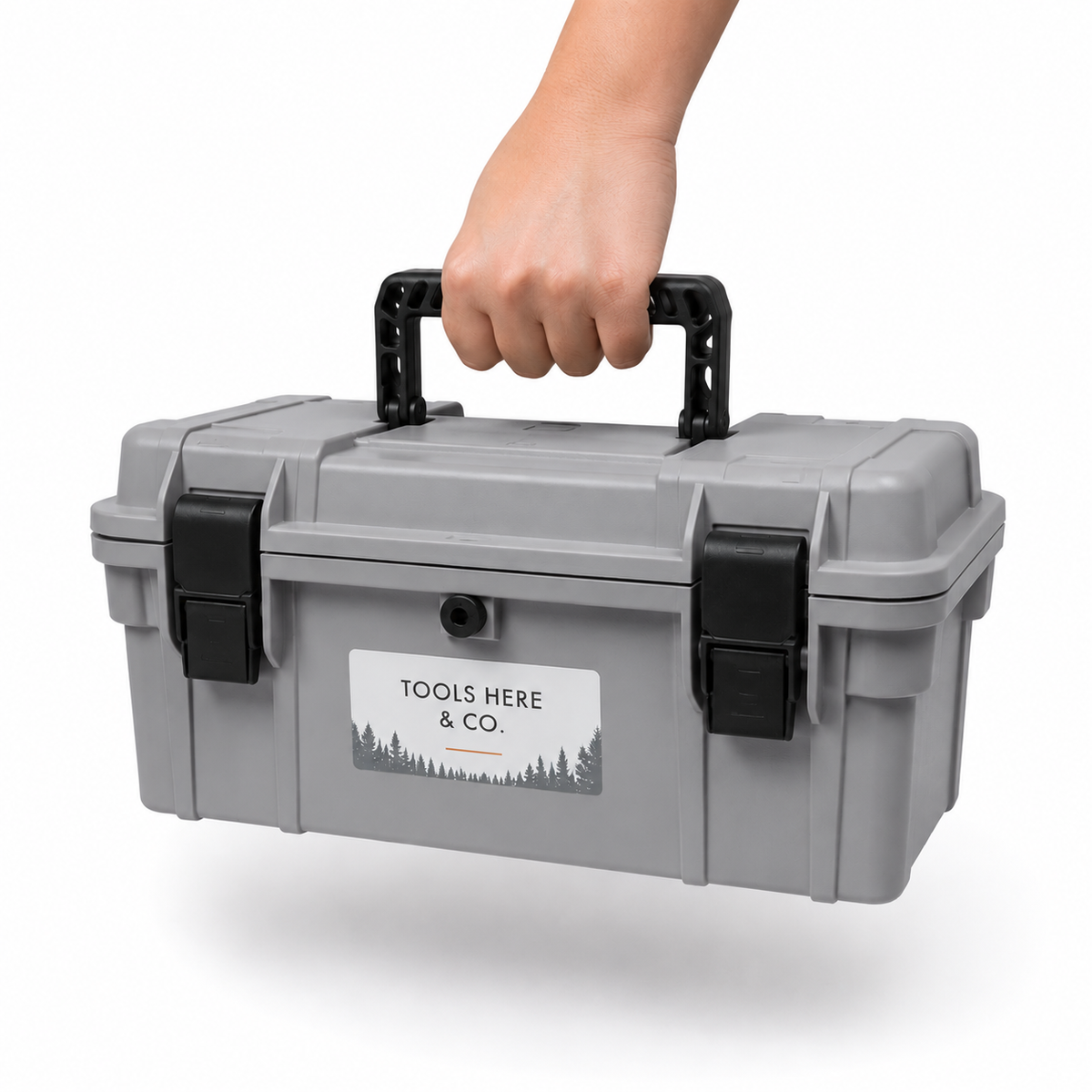 Hand carrying the 18-inch rubber-sealed toolbox in grey by the fold-flat handle