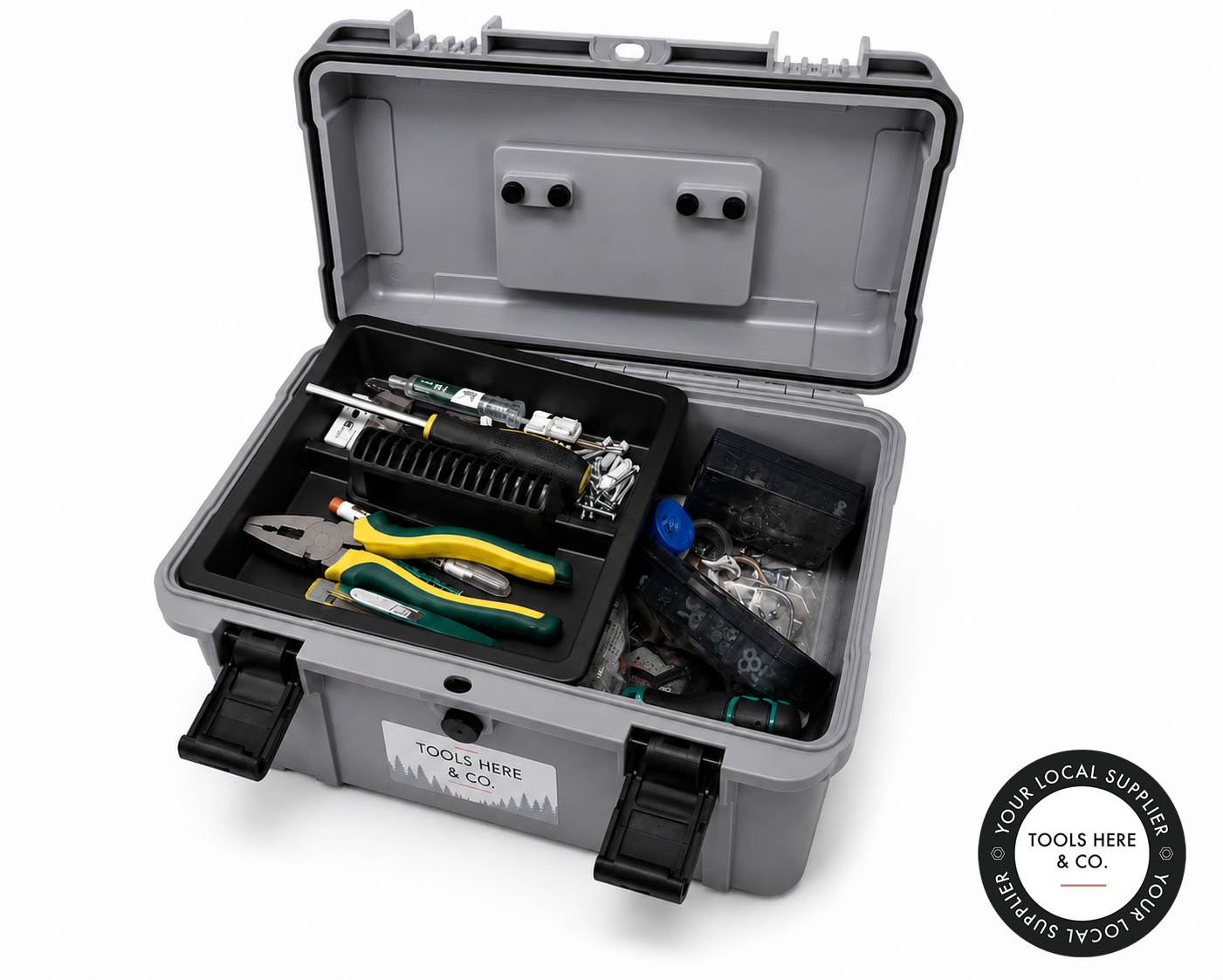 An open gray hard-shell tool case on a white background, filled with various hand tools including pliers, screwdrivers, and a small flashlight. 